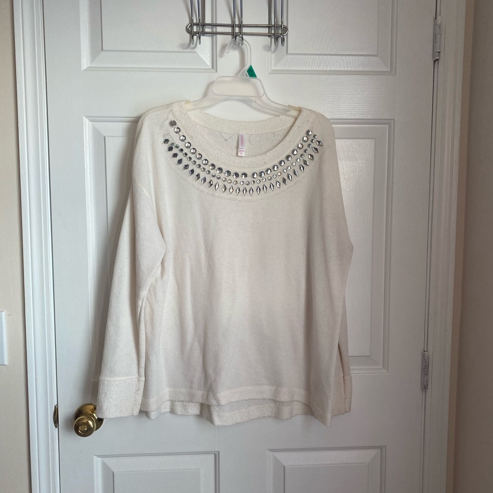 Cream sweater with bejeweled neckline